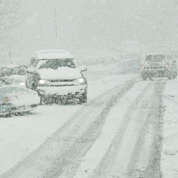 Image of cars that have gone off the road in a snow storm Image of cars that have gone off the road in a snow storm