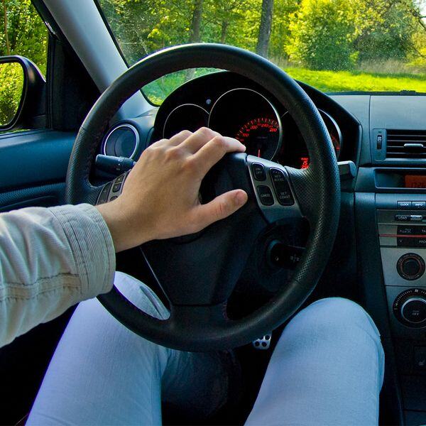 Image of a person honking the horn of his car Image of a person honking the horn of his car