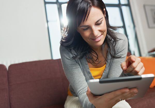 Woman using tablet to learn