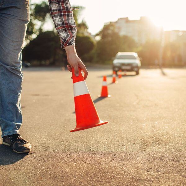 someone setting up cones