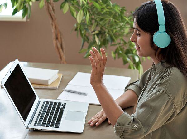 woman asking question during online class